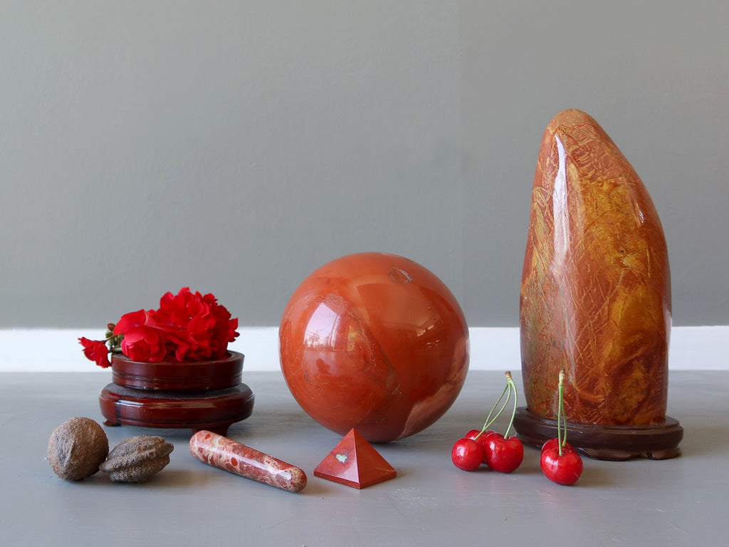 red crystals, flowers, cherries and moqui stones for the root chakra
