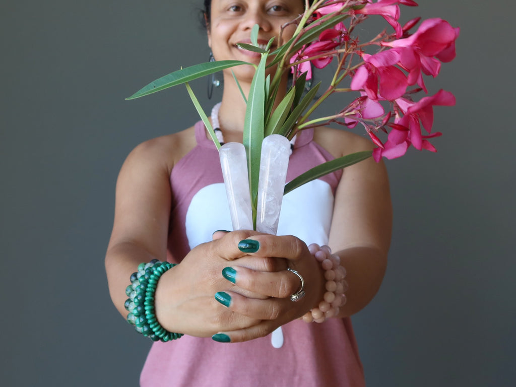 sheila of satin crystals holding pink flowers and rose quartz bouquet
