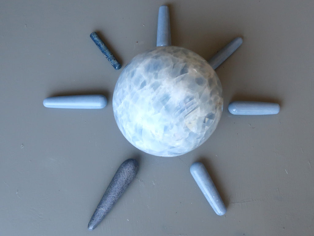 blue calcite balls surrounded by blue massage wands