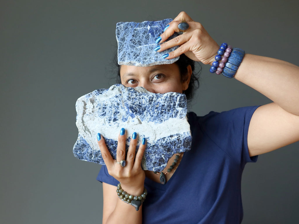 sheila of satin crystals peaking between two sodalite slabs