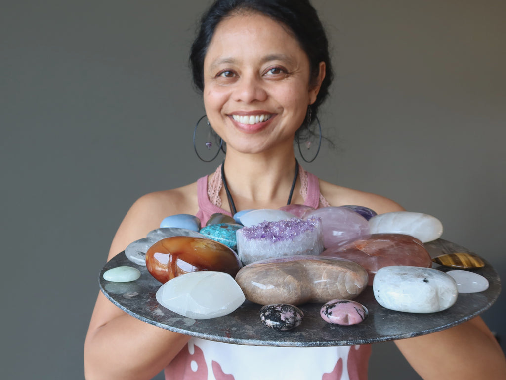 sheila of satin crystals holding a platter of crystal hearts