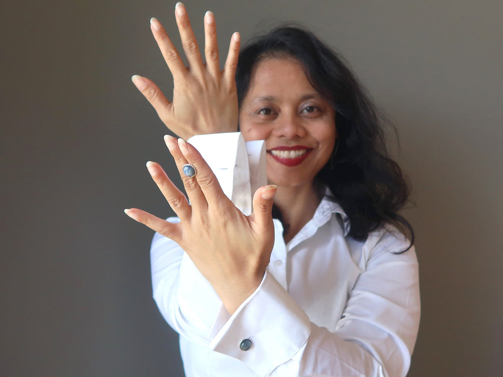 woman with blue cufflinks and white shirt