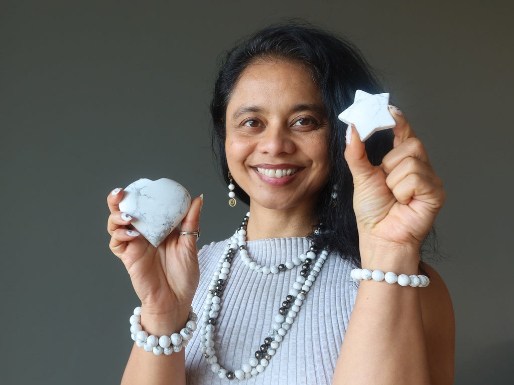 woman holding howlite star and heart