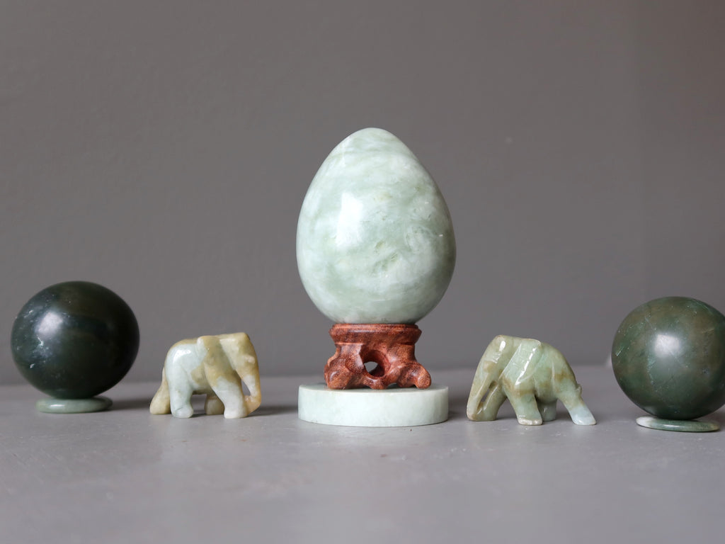 jade egg, elephants, and spheres