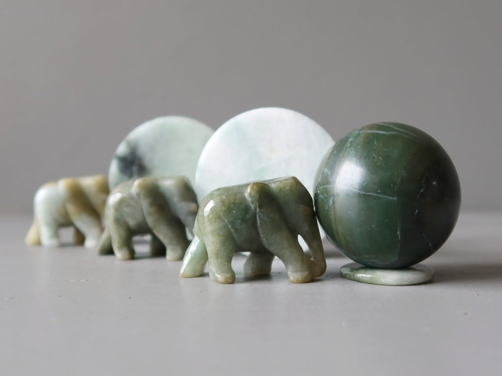 jade elephants pushing jade spheres and circles