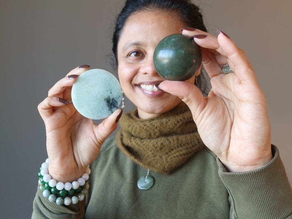sheila of satin crystals holding nephrite sphere and jadeite circle stone