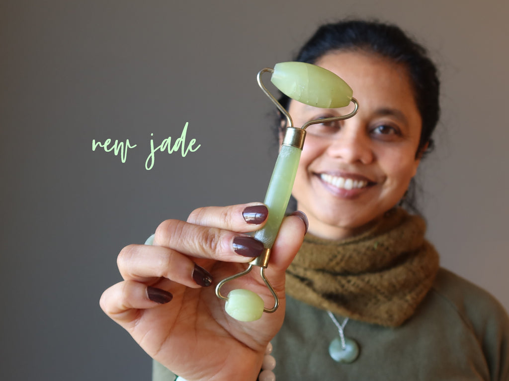 woman holding new jade facial roller wand