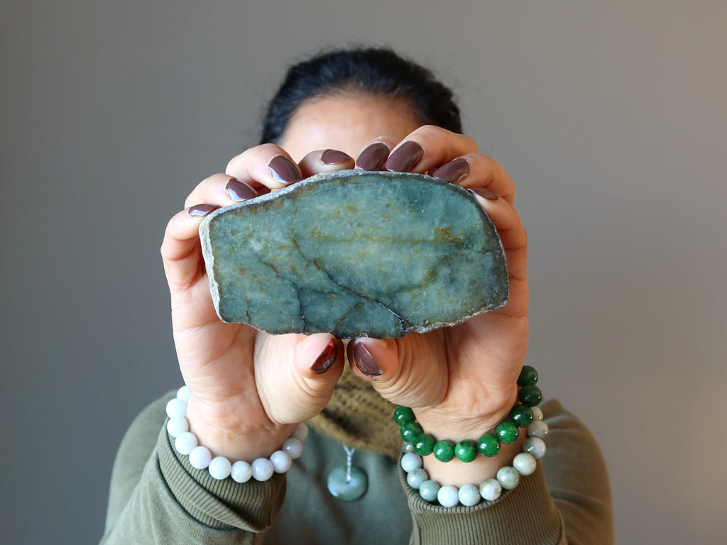 sheila of satin crystals holding and wearing real green jade