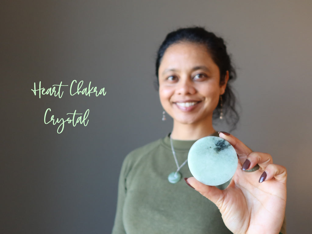 sheila of satin crystal holding jade circle at her heart chakra