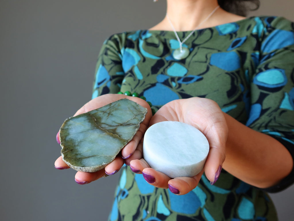 woman holding jade polished stones