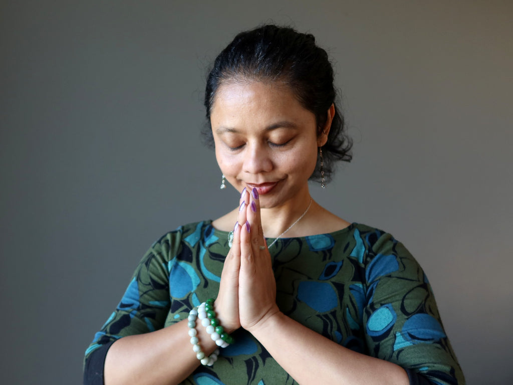 sheila of satin crystals with hands in prayer