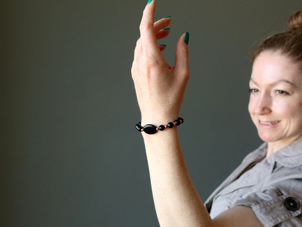 woman wearing jet bracelet