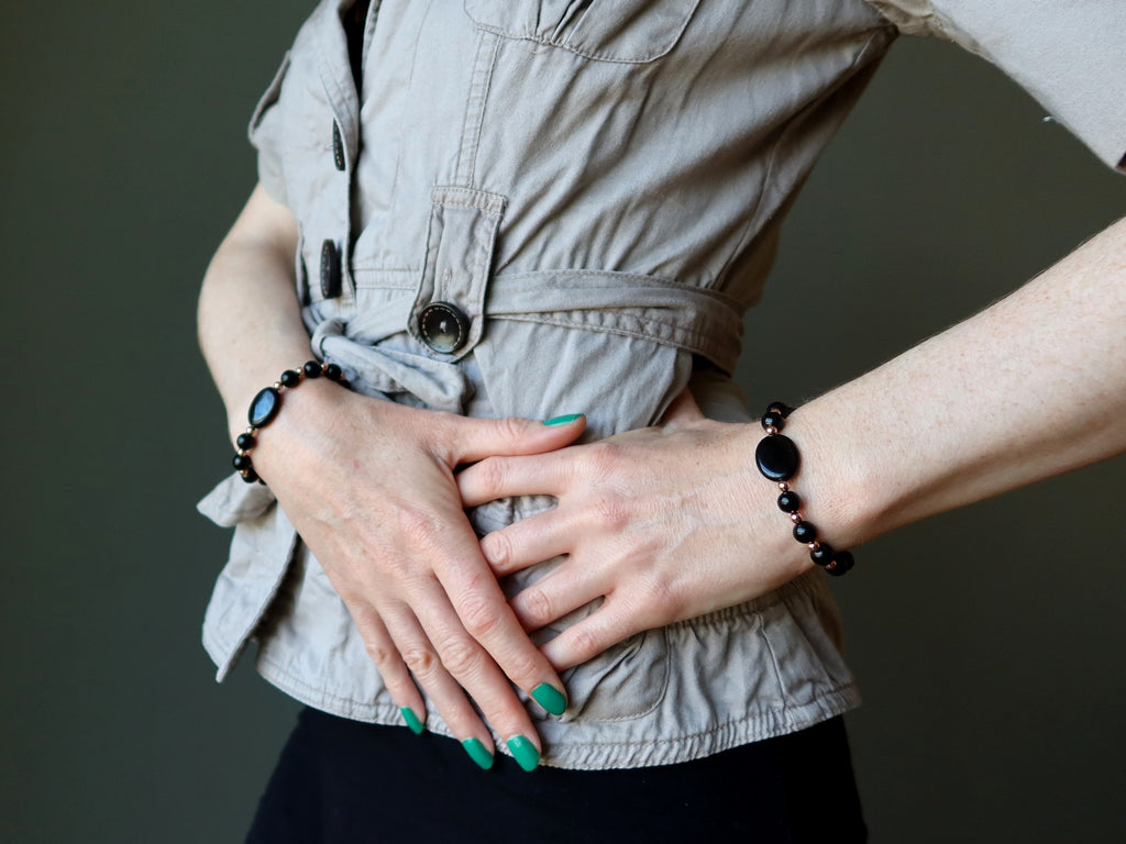 woman wearing jet bracelets