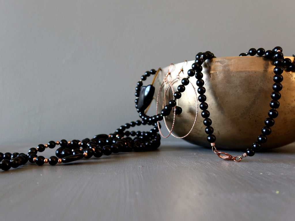 jet stone jewelry and tibetan singing bowl