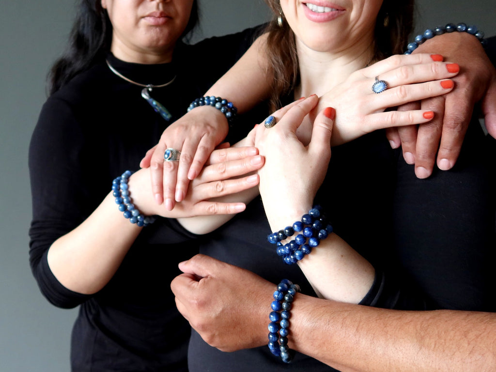 models stacked with kyanite bracelets