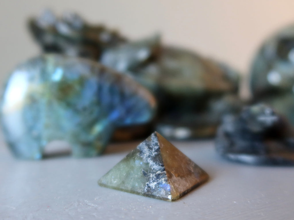 labradorite pyramid and collection of stones