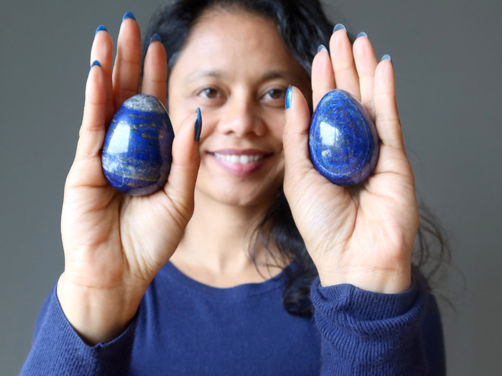 sheila of satin crystals with two lapis lazuli eggs in her palms