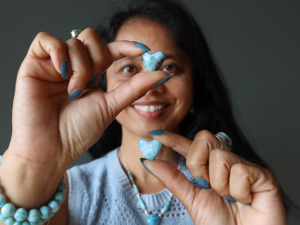 woman with two larimar hearts