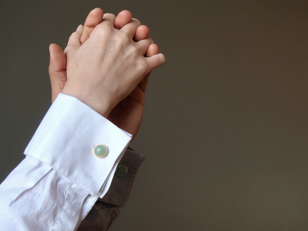 Hands in dance wearing cufflinks