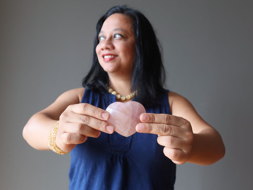 lisa satin holding rose quartz heart