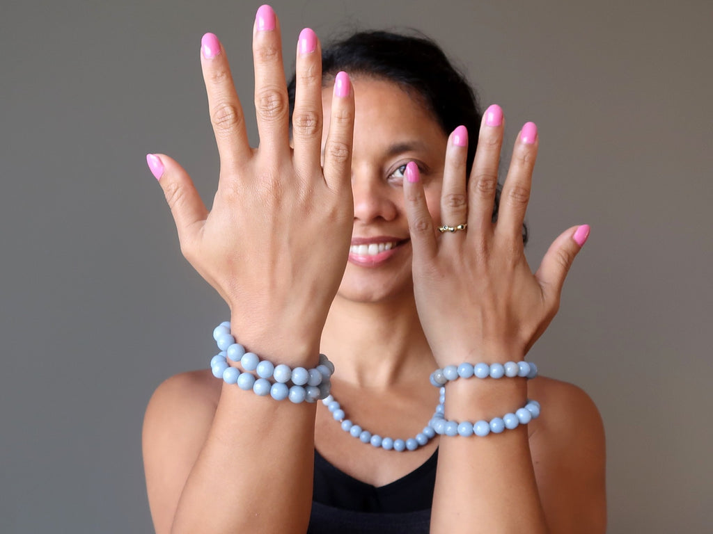 sheila of satin crystals showing off stackable angelite stretch bracelets