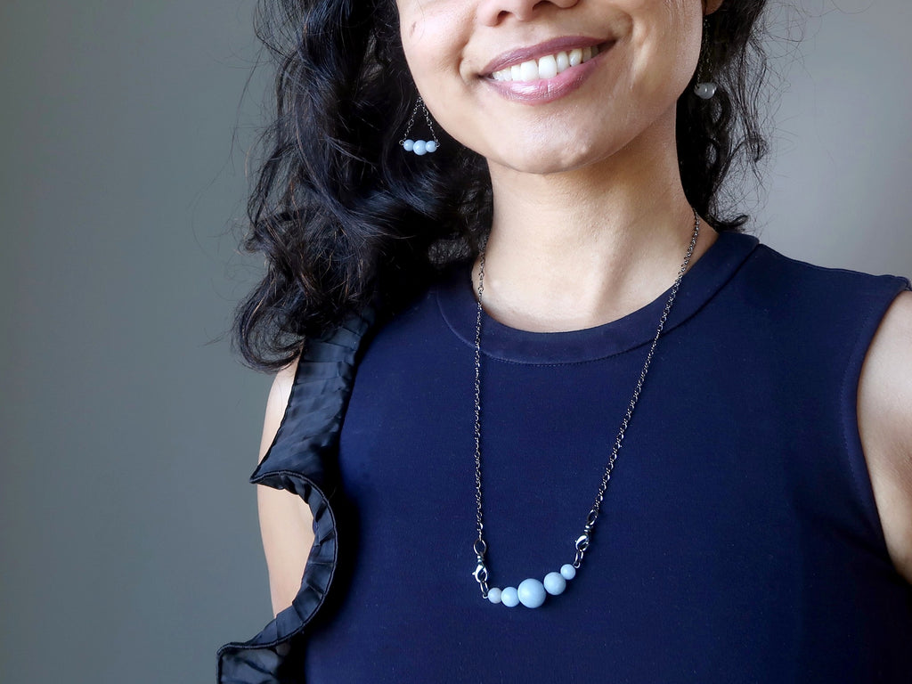 sheila of satin crystals wearing cloud angelite necklace and matching earrings