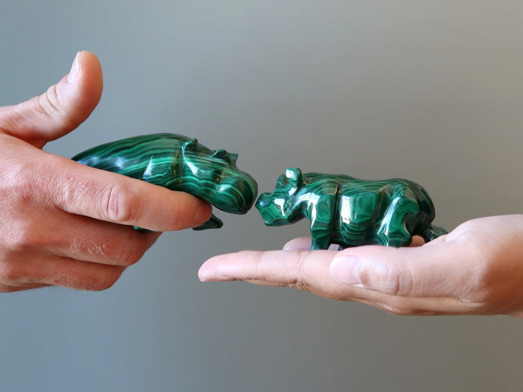 malachite rhino and malachite hippo touching noses