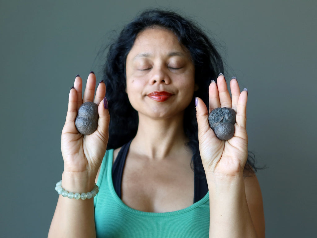 sheila of satin crystals meditating with moqui marbles in her palms