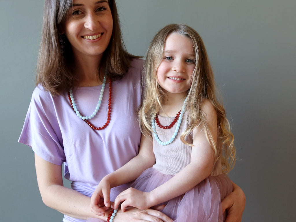 mother daughter in aquamarine carnelian necklaces
