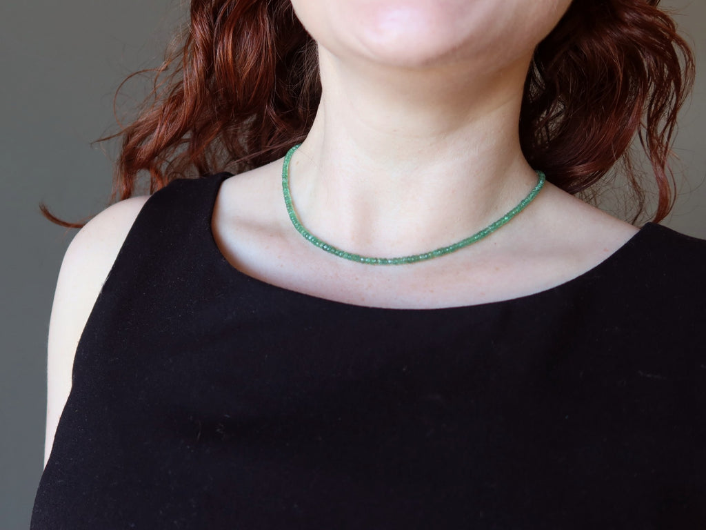 green emerald necklace on woman