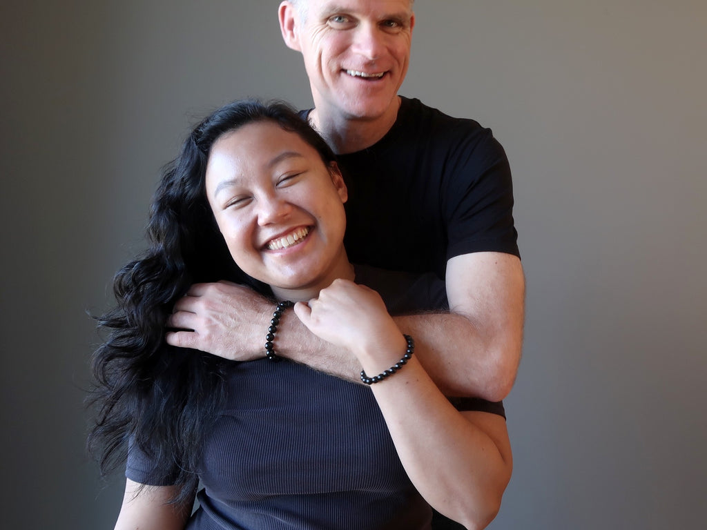 couple wearing black jet bracelets