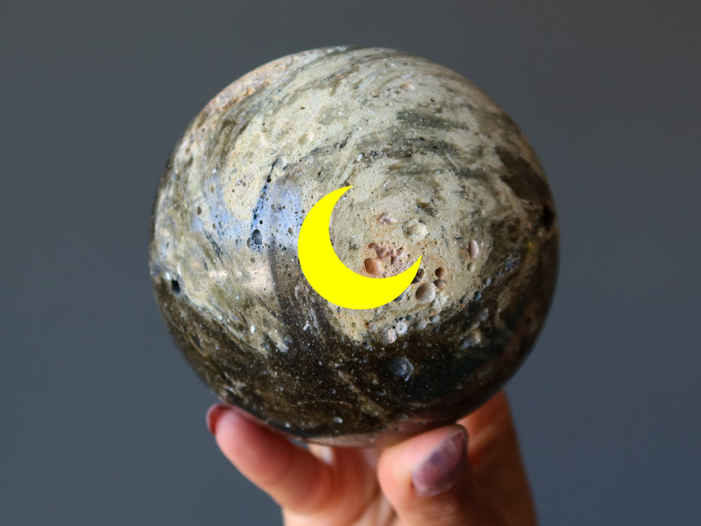 zhamanshin impactite sphere with new moon image