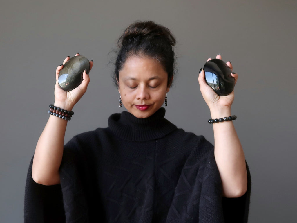 Sheila of Satin Crystals meditating with Golden Sheen Obsidian palm stones