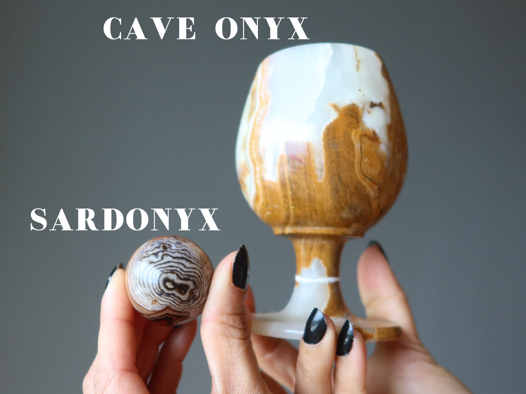 hands holding up a sardonyx sphere and a cave onyx goblet