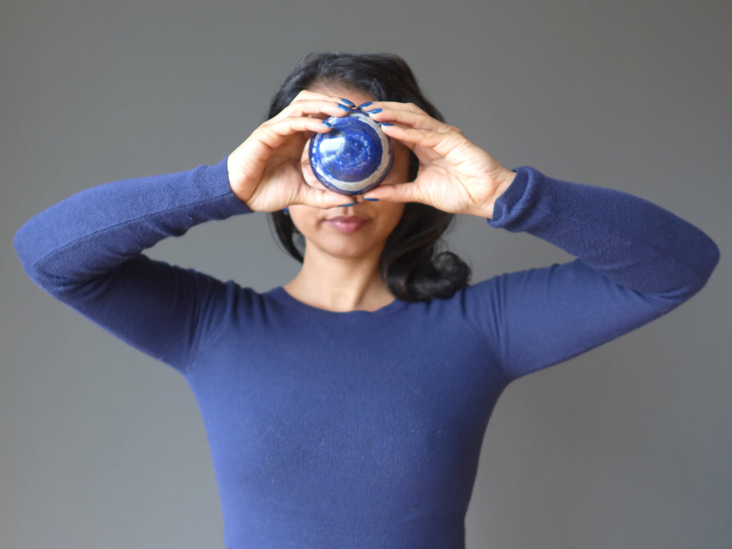 lapis lazuli sphere at the third eye for balance