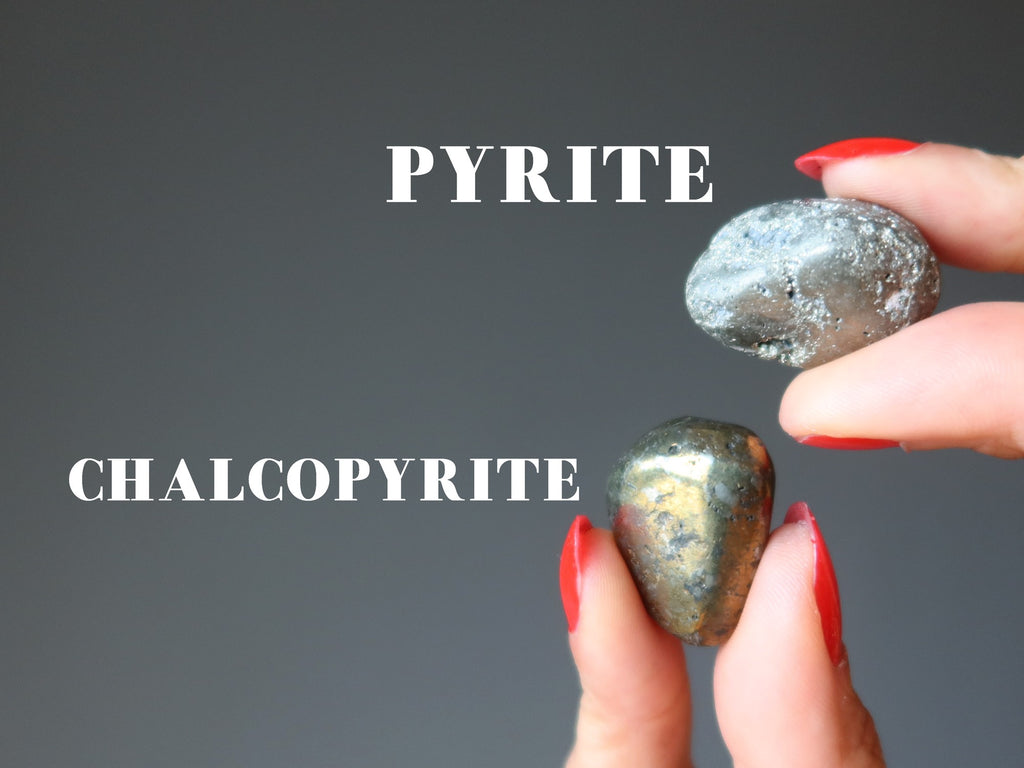 hands holding pyrite and chalcopyrite tumbled stones