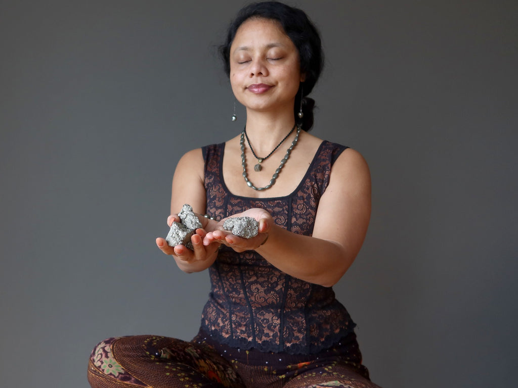 sheila of satin crystals meditating with pyrite clusters