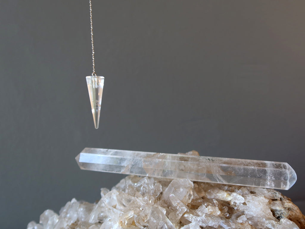 quartz crystal cluster, wand and pendulum
