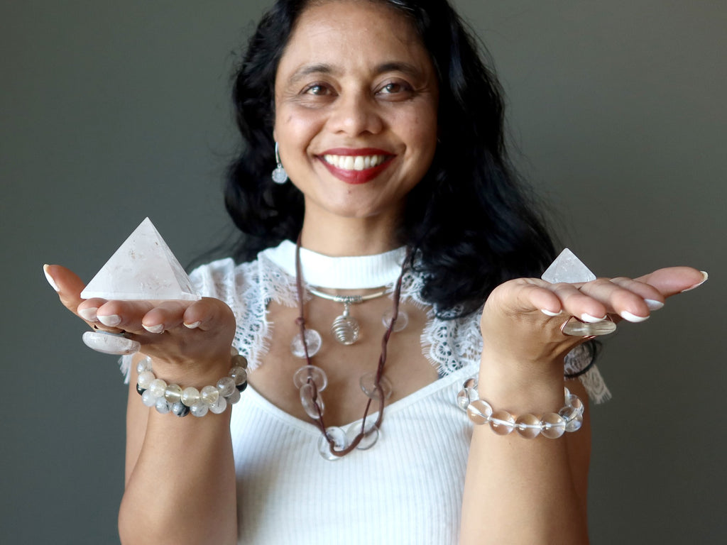 sheila of satin crystals holding quartz pyramids