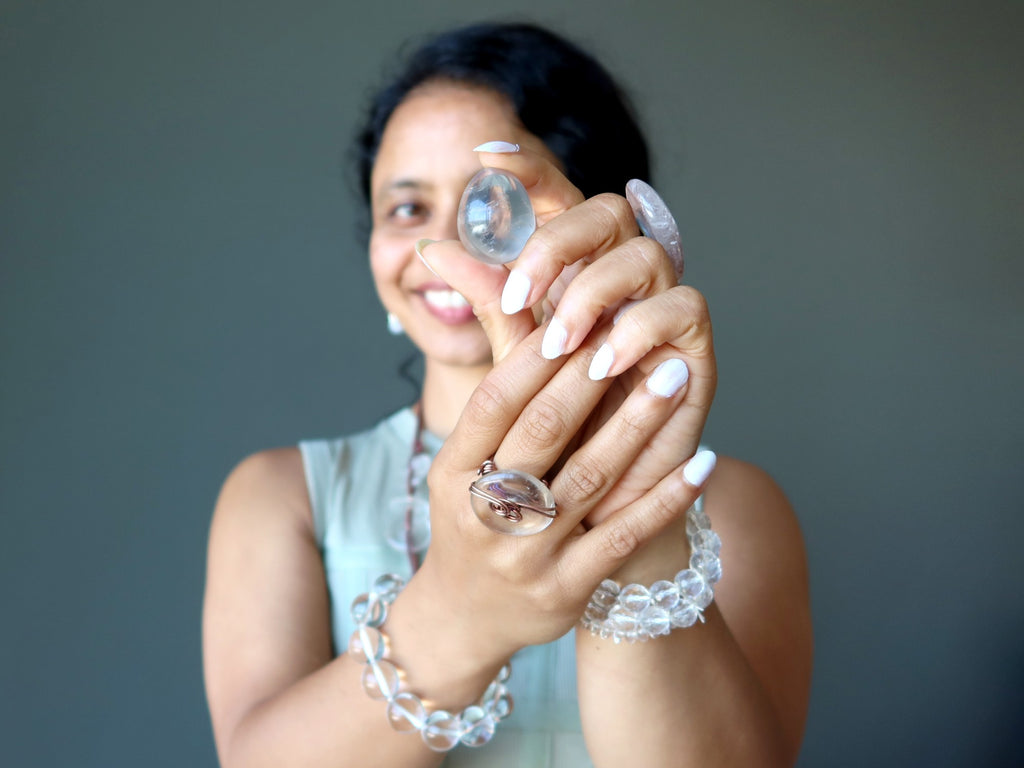 sheila of satin crystals holding quartz egg and wearing quartz jewelry