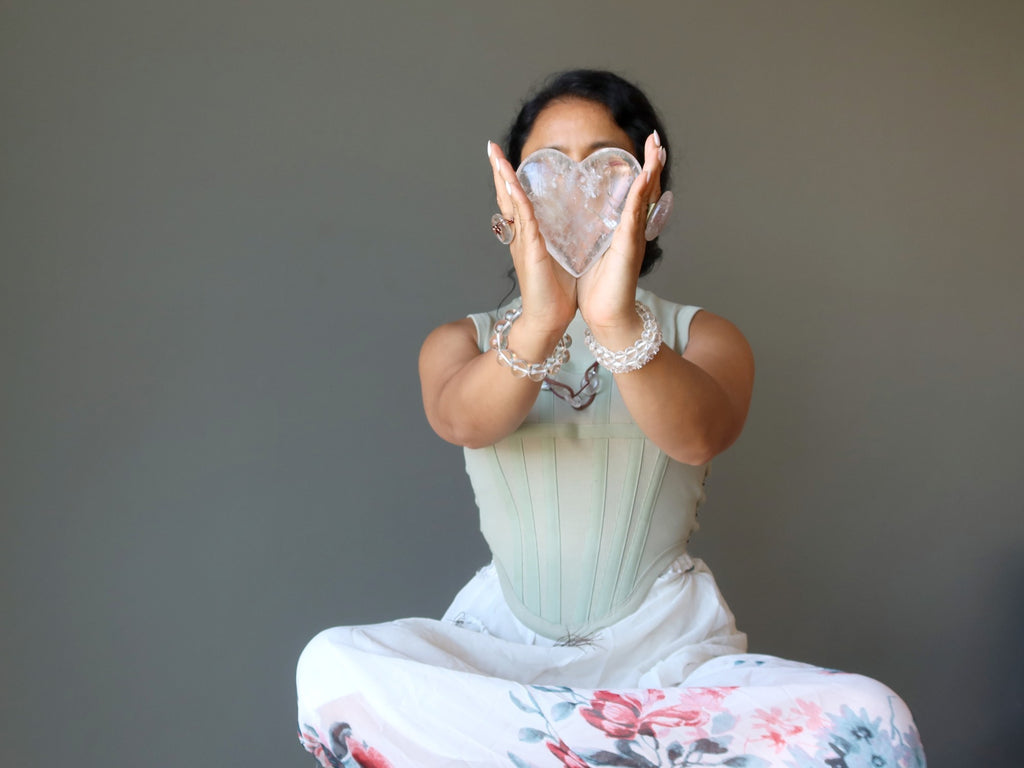 sheila of satin crystals meditating with clear quartz heart