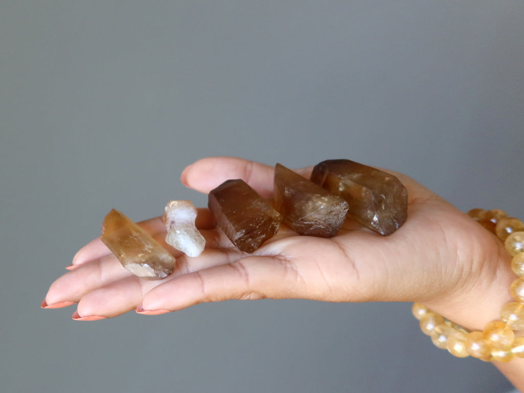 citrine points in palm of hand