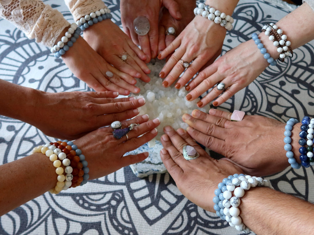 hands on quartz crystal cluster