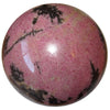 natural pink and black rhodonite stone sphere - satin crystals meanings