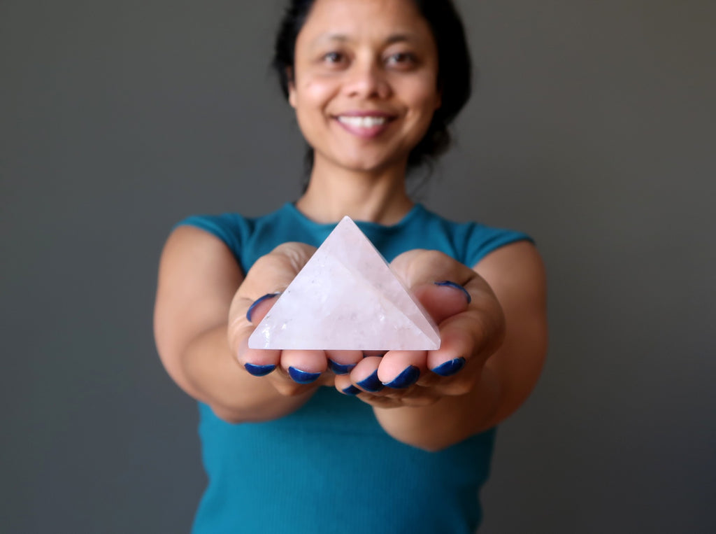 sheila of satin crystals holding a rose quartz pyramid
