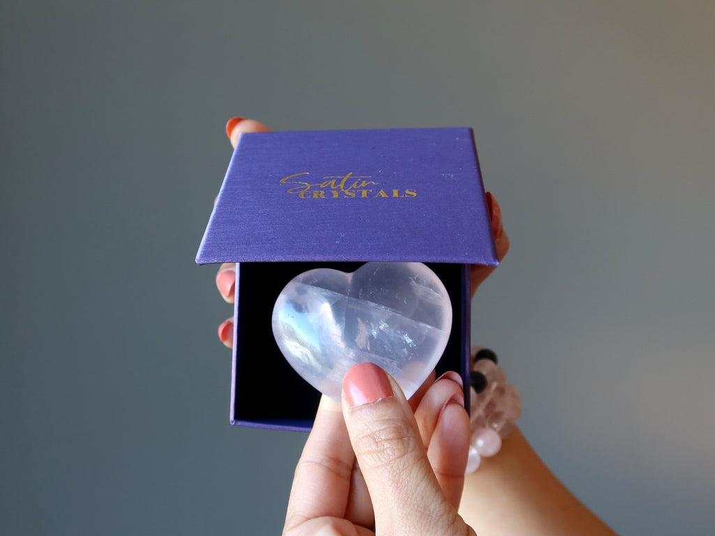 rose quartz heart in a purple satin crystals gift box