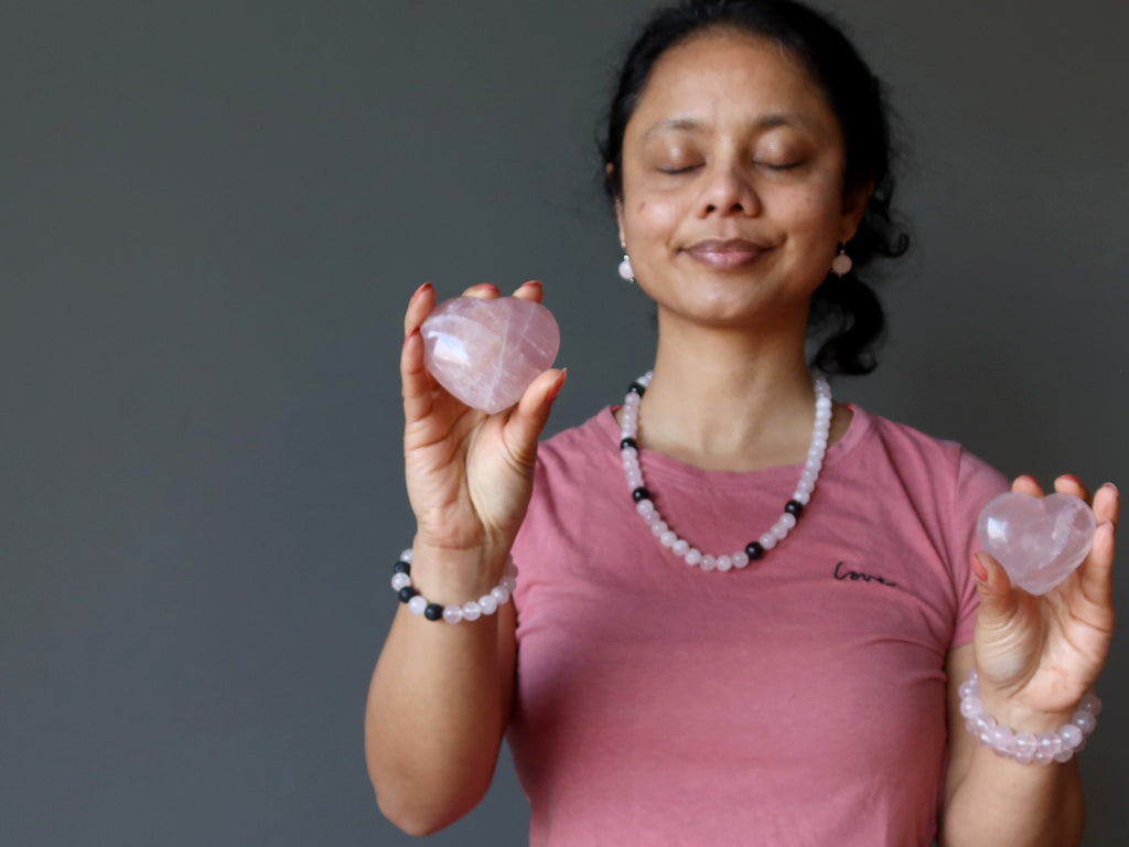 sheila of satin crystals holding two rose quartz hearts