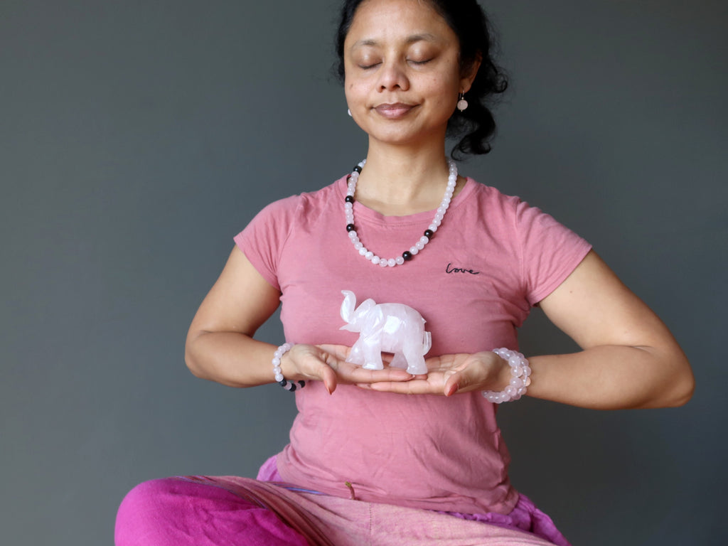 sheila of satin crystals meditating with a pink rose quartz elephant