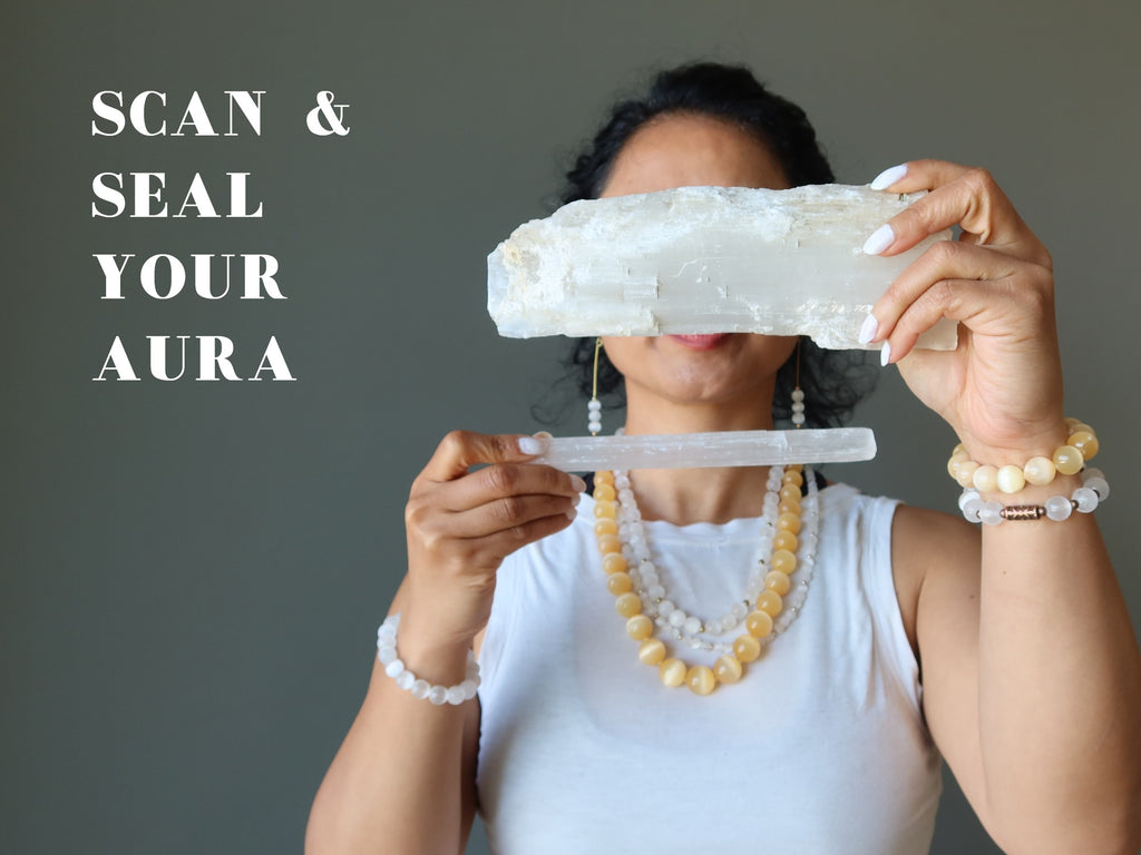 woman scanning the aura with selenite sticks