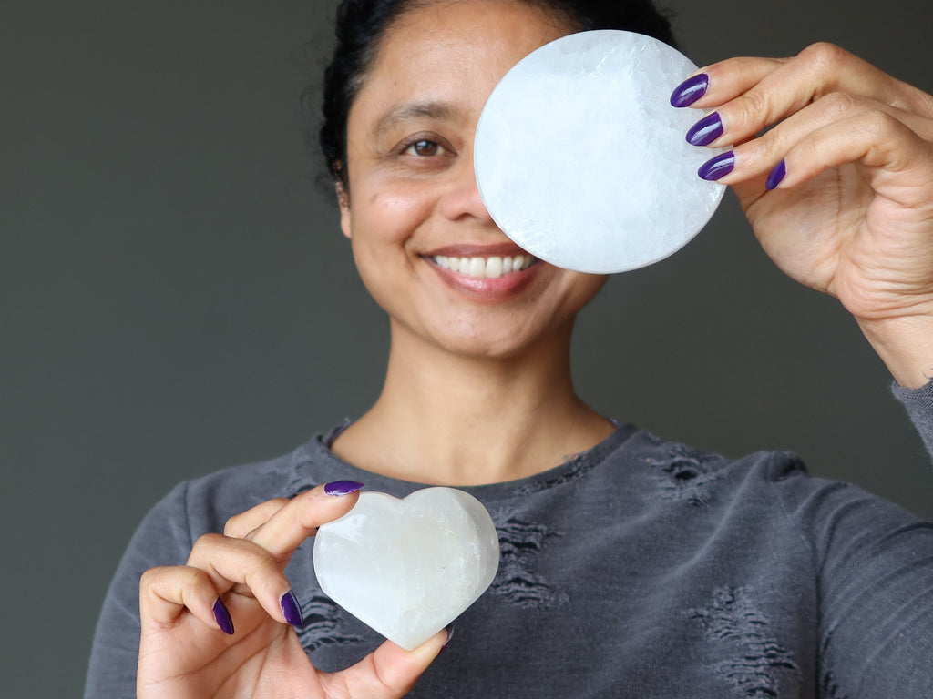 sheila of satin crystals holding selenite circle and heart